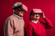 © Canvas Alchemy - Senior mature couple having fun with virtual reality glasses. Old people using new headset goggles trends technology