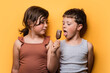 © ADDICTIVE STOCK - Cute girl sharing ice cream bar with boy