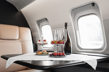 Canvas Print - Business jet plane interior with leather comfortable seats. Private airplane transfer 