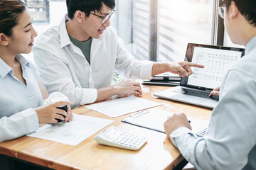 Poster - Asian couple meeting with financial advisor pointing data on scr