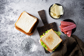 Wall Mural - Sandwich with sausage, cheese and tomato for lunch