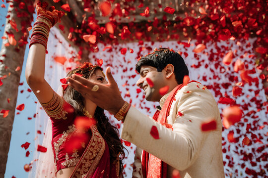 Indian Wedding Couple With Flowers Petals Falling Down: AI Generated Image