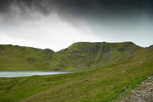 Helvellyn Mountain Peak With Striding Edge Ridge And Red Tarn