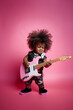 © lagano - Little baby girl playing electric guitar against  light pastel pink background. Concept of happiness, good music, children's party, birthday celebrations. Generative AI.