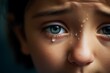 a closeup photo of a young boy child crying eye and face. tears on the face. Generative AI