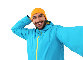 Wall Mural - Smiling young man taking selfie on white background