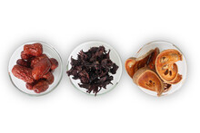 Top View Of Asian Dried Fruits, Bael, Okra And Jujube In Glass Bowls.
