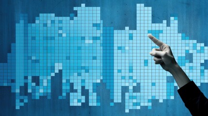 Close up of businessman hand pointing at business graph on blue wall background