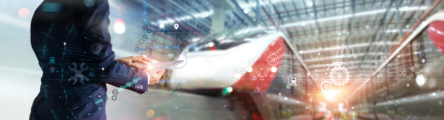 Fototapete - Engineer uses a tablet to inspect and analyze the route of a networked train information system before releasing the train from a major station junction. modern industry and transportation.
