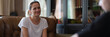 © megaflopp - Young smiling woman talking to psychologist at therapy session