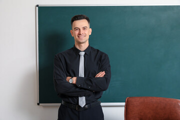 Sticker - Male teacher near chalkboard in classroom