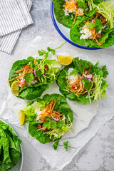 Wall Mural - Asian minced meat lettuce wraps with rice, bean sprouts and cabbage