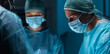 © Acronym - Team of medical doctors performs surgical operation in modern operating room using high-tech technology. Surgeons are working to save the patient in the hospital. Medicine, health and science.