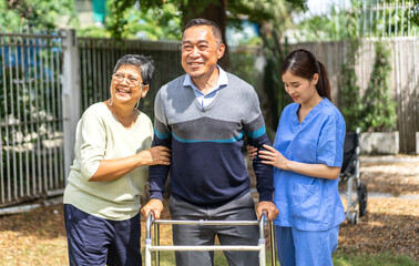 Portrait of smiling caring asian nurse service help support discussing and consulting taking care with senior elderly asian man and woman couple at home visit.senior retirement home care concept