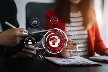 Person typing laptop computer and tablet with SDK icon on virtual screen. SDK Software development kit programming language technology concept in office.