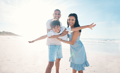 Poster - Adventure, beach and parents holding their kid on the sand by the ocean on a family vacation. Happy, smile and boy child flying and bonding with hid young mother and father on tropical summer holiday