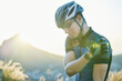 © Wesley JvR/peopleimages.com - Man, cycling and training with muscle injury, shoulder pain or stress in helmet for safety, fitness or exercise. Cyclist, emergency and medical problem in countryside for workout, race or performance