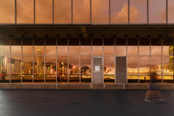 Aufkleber - Reflection of skyline of Victoria harbor of Hong Kong city on the exterior of modern architecture
