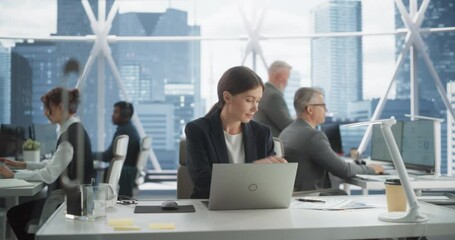 Poster - Professional Female Business Development Manager Typing On Laptop Computer In Bright Skyscraper Office In Downtown. Successful Caucasian Woman Working With Annual Reports In Diverse Workspace.