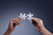 Hands holding jigsaw puzzles, business matching concept