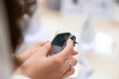 © Mihail - woman in the store choosing the new digital watch