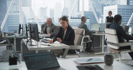 Poster - In Big Corporate Skyscraper Office: Beautiful Caucasian Female Business Manager Using Computer, Businesspeople and Experts Working Around Her, Analysing Statistics, Commerce Data, Marketing Plans.