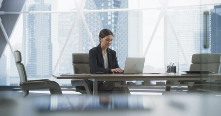 Poster - Professional Female CEO Typing On Laptop Computer In Bright Megapolis View Corner Office. Caucasian Woman Working Alone In Meeting Room Of Investement Management Firm, Looking For Startups to Invest.