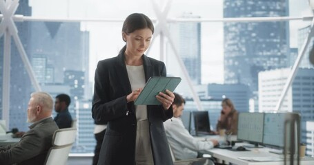 Poster - Successful Businesswoman Using Tablet Computer, Standing in Modern Diverse Office in Downtown And Working on Financial, Business and Marketing Projects. Portrait of Beautiful Caucasian Manager.