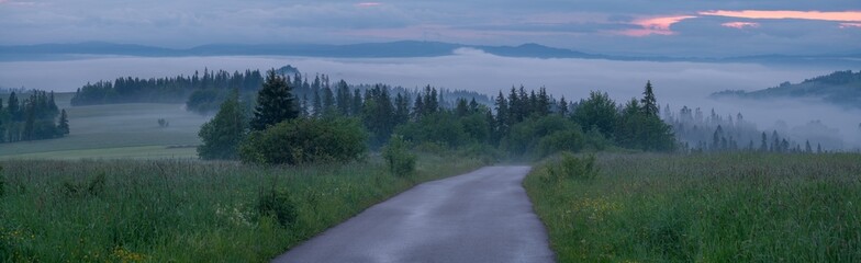 Mountain road during a foggy morning