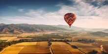 A Hot Air Balloon Over A Valley