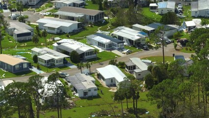 Poster - Severely damaged houses after hurricane Ian in Florida mobile home residential area. Consequences of natural disaster