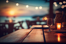 Outdoor Restaurant At The Beach. Table Setting At Tropical Beach Restaurant. Beautiful Sunset Sky, Sea View. Luxury Hotel Or Resort Restaurant.