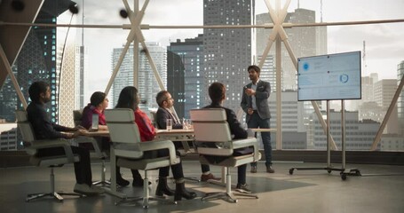 Wall Mural - Diverse Indian Office Conference Room: Young South Asian CEO Makes a Presentation for Entrepreneurs, Talking, Using TV with Infographics and Statistics. Businesspeople Talk About an Ecommerce Startup