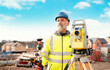 © Iryna - Surveyor builder site engineer with theodolite total station at construction site outdoors during surveying work