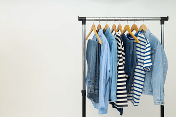 Wall Mural - Wardrobe rack with different clothes, concept of different clothes