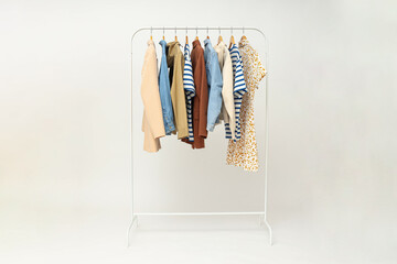 Wall Mural - Wardrobe rack with different clothes, concept of different clothes