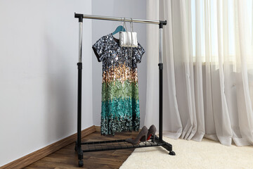 Wall Mural - Wardrobe rack with female clothes, concept of evening clothes