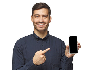 Handsome businessman in deep blue shirt showing phone and pointing with finger at blank screen with copy space