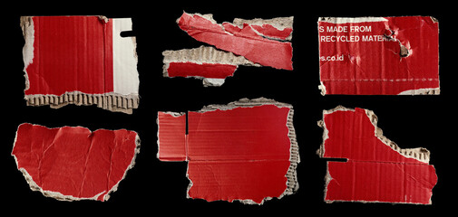 Set of ripped red cardboard pieces isolated on black background