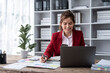 © Wuttichaik - Young beautiful joyful successful happy woman smiling working in office, Manager Accountant Accounting ecommerce owner bookkeeping calculation taxes rates  firm law owner interest loan financial