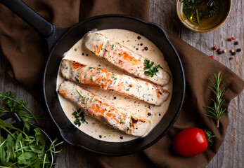 Wall Mural - Cooked salmon fish with cream sauce in frying pan