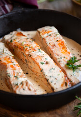 Wall Mural - Cooked salmon fish with cream sauce in frying pan