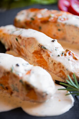 Wall Mural - Cooked salmon fish with cream sauce in frying pan