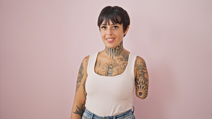 Hispanic woman with amputee arm smiling confident standing over isolated pink background