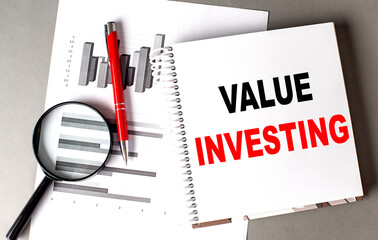 Poster - VALUE INVESTING text written on notebook with chart