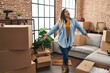 © Krakenimages.com - Young beautiful plus size woman smiling confident standing at new home