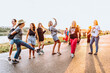 © larisikstefania - dancing cheerful attractive women at sunset.