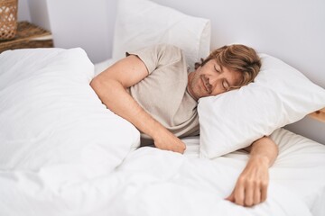 Canvas Print - Young man lying on bed sleeping at bedroom