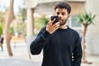 © Krakenimages.com - Young arab man smiling confident talking on the smartphone at street