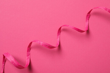 Wall Mural - Concept of different ribbons, pink ribbon on pink background